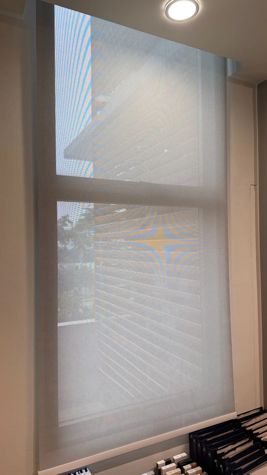 A light-filtering blind fitted to a tall window